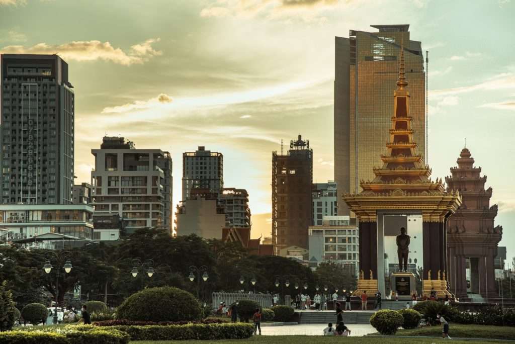 a city with tall buildings and a clock tower